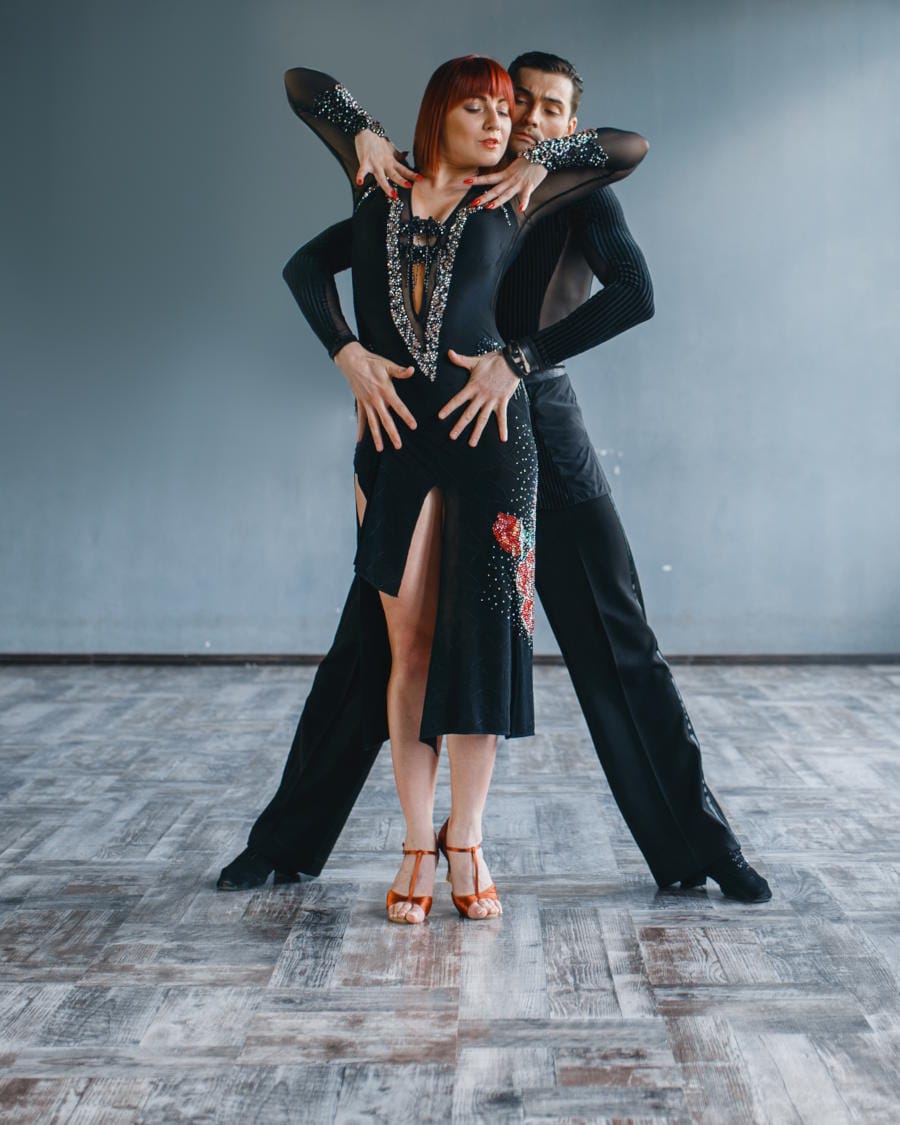 Two professional dancers, dancing samba
